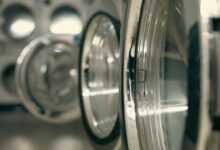 a row of silver and black washing machines